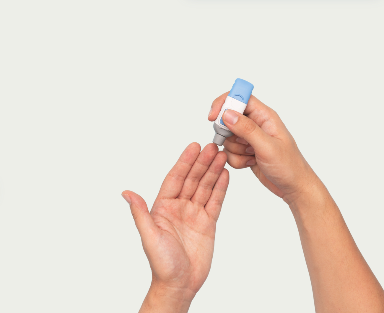 Hand doing a finger prick with a lancet.