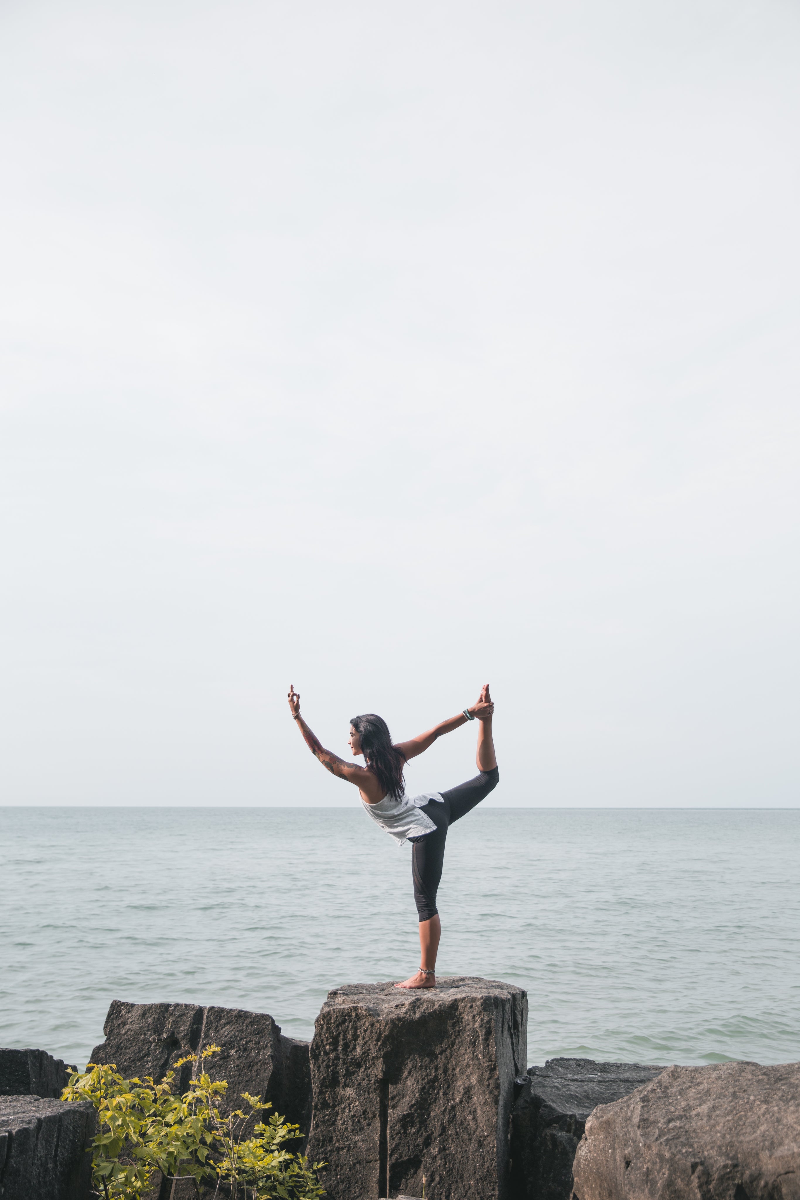 A woman doing a yoga pose in nature